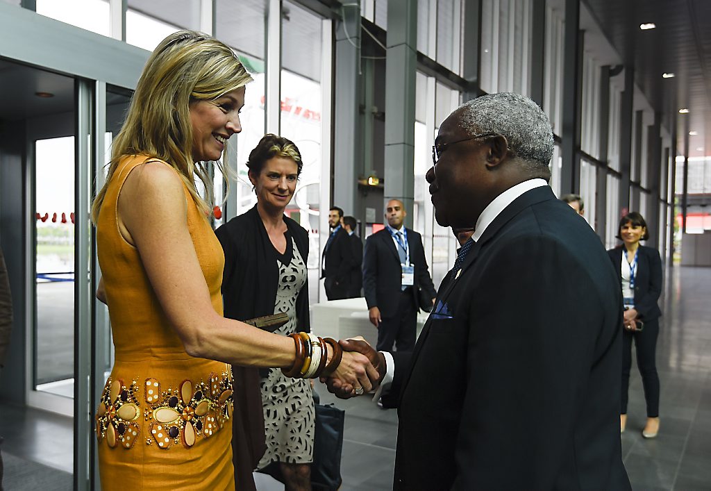 Queen Maxima of the Netherlands is welcomed by IFAD's President, Nigeria's Kanayo F. Nwanze as she arrives at the Global Forum on Remittances Development 2015 (GFRD), on June 16, 2015 in Rho, Italy. AFP PHOTO / OLIVIER MORIN