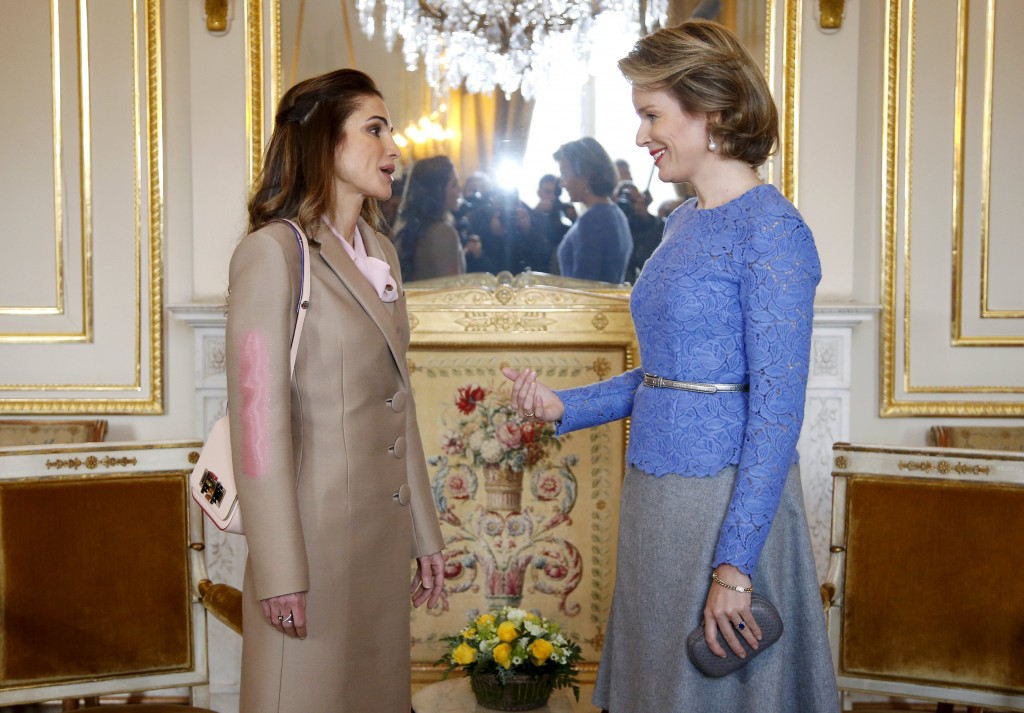 Jordan's Queen Rania talks to Belgium's Queen Mathilde at Brussels' Royal Palace