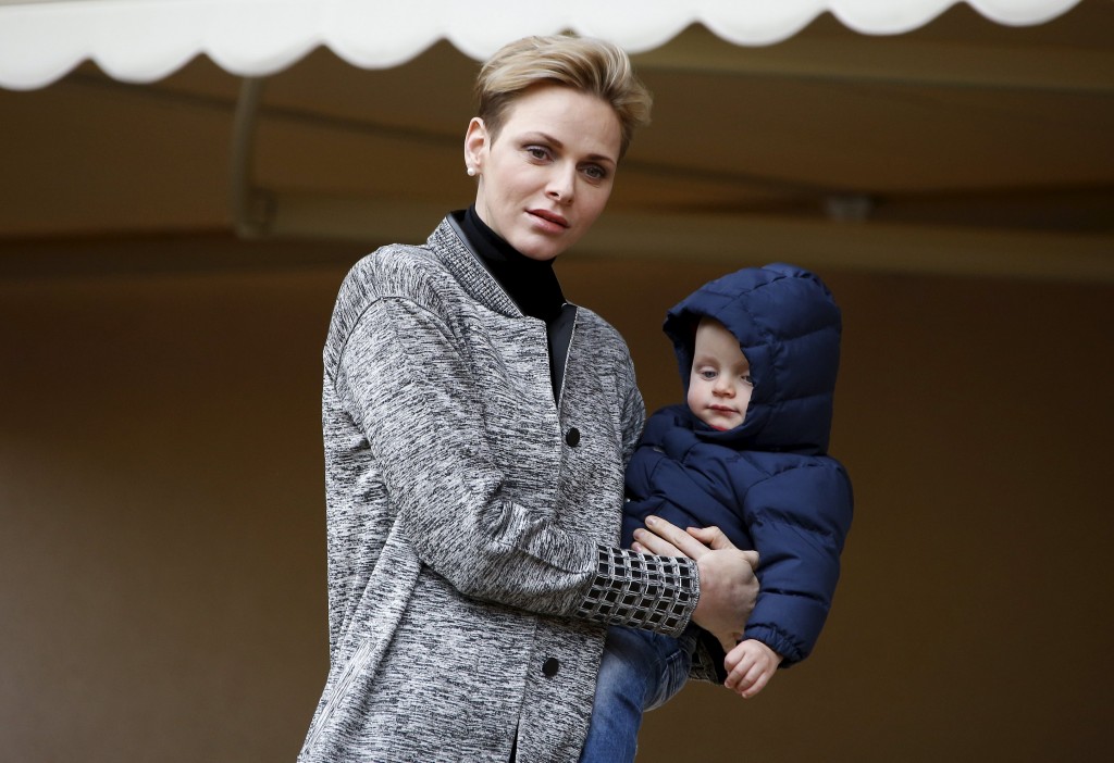 Princess Charlene of Monaco arrives with her son Prince Jacques to attend Sainte Devote rugby tournament at Louis II Stadium in Monaco