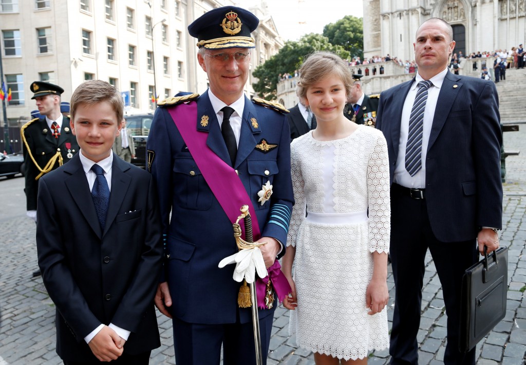 Belgium's King Philippe poses with his children after a religious service at the Sainte-Gudule cathedral on Belgian national day in Brussels