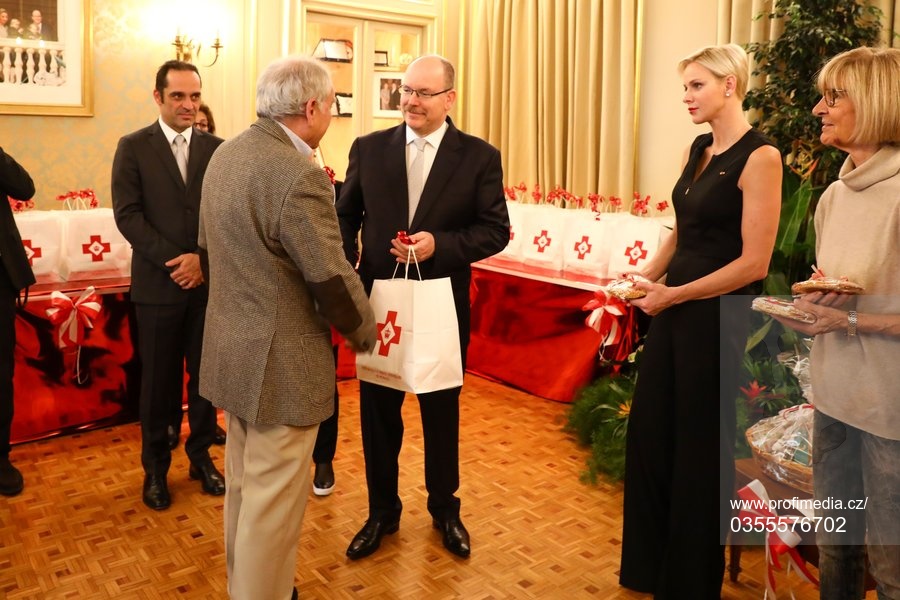 Prince Albert II and Princess Charlene of Monaco offer gifts