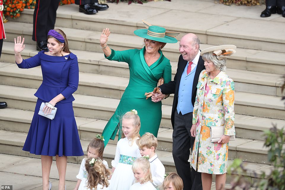 4988224-6268487-Beatrice_and_Sarah_the_Duchess_of_York_left_stood_next_to_George-a-111_1539344692052