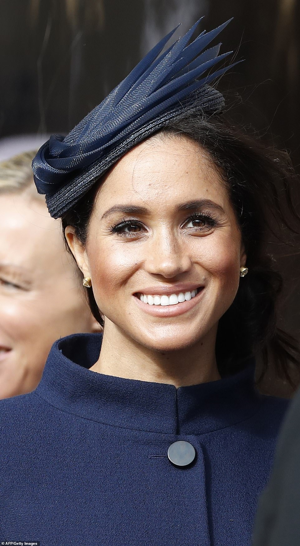 4990012-6268487-The_Duchess_of_Sussex_smiles_as_she_waits_for_the_carriage_carry-a-219_1539347493854
