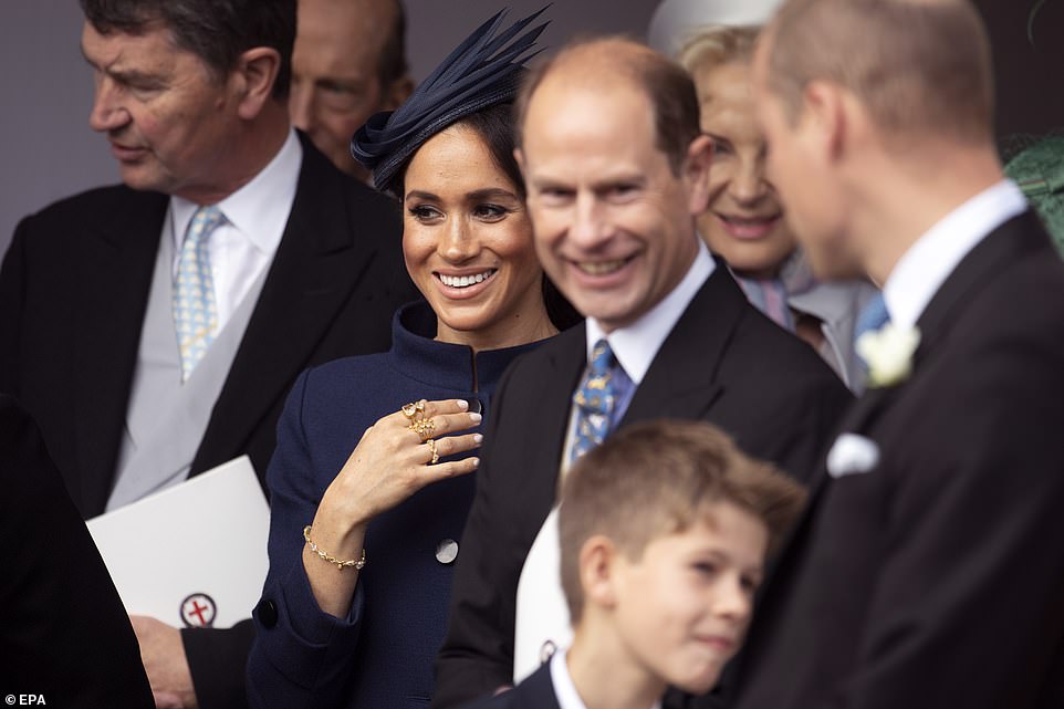 4991376-6268487-Meghan_is_seen_centre_following_the_ceremony_which_lasted_for_ar-a-62_1539349647429